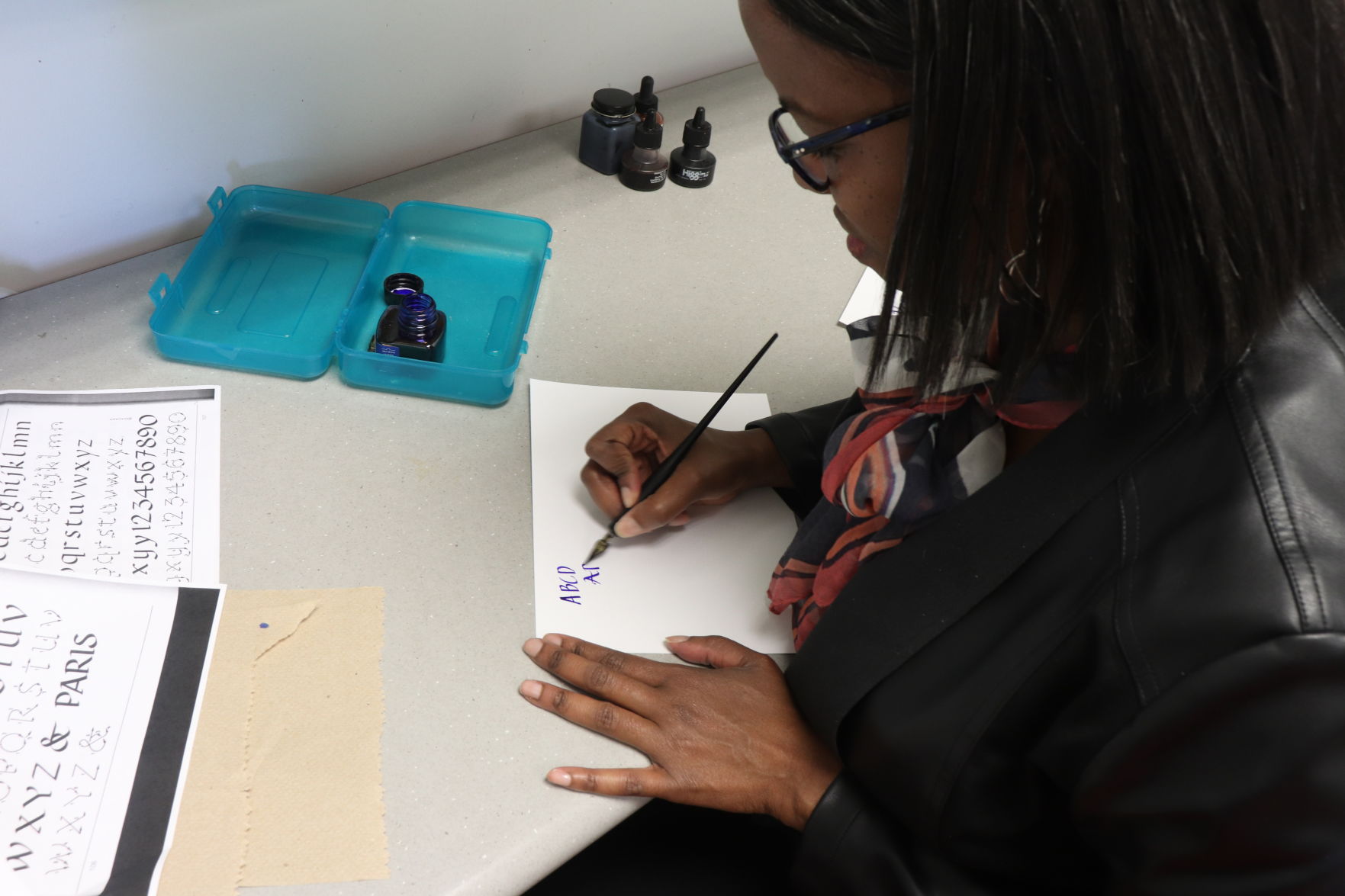 Lisa Lenoir hand-letters in her office.